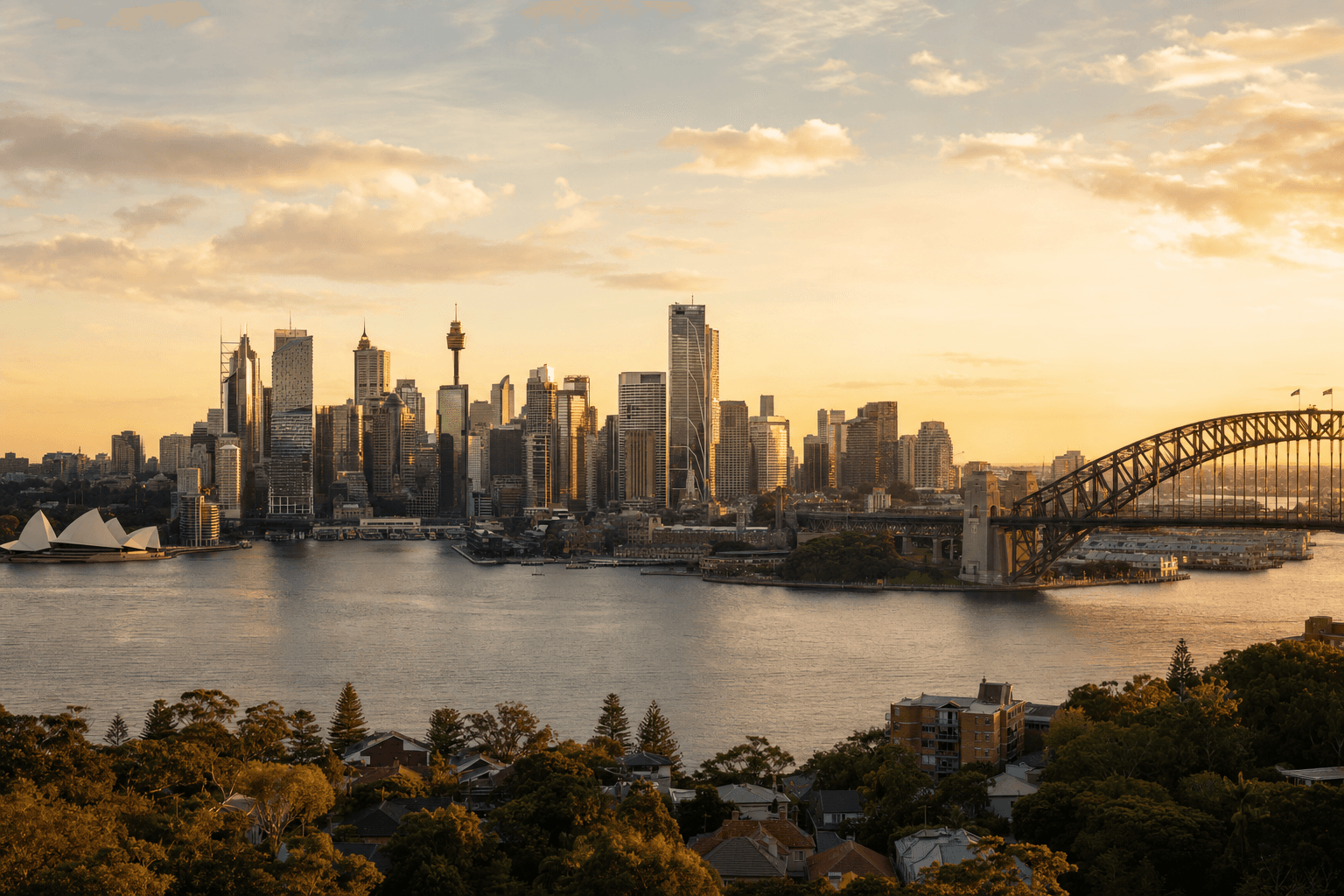 Sydney city skyline at golden hour with Harbour Bridge